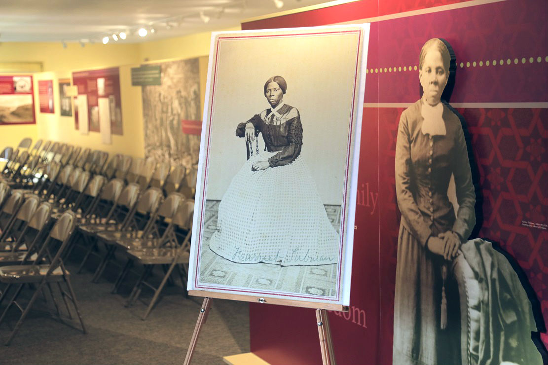 Members of the nonprofit Harriet Tubman Home, Inc. are attempting to purchase a rare photo of a young Tubman in her 40s that will be going up for auction this month. Shown here center is a reproduction of the photo inside the Harriet Tubman National Historical Park's visitor's center. Michael D. Regan/PBS NewsHour 