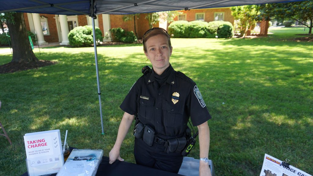 Jones at a stand for the local police department at the Bowling Green farmer’s market. Photo by Alison Thoet