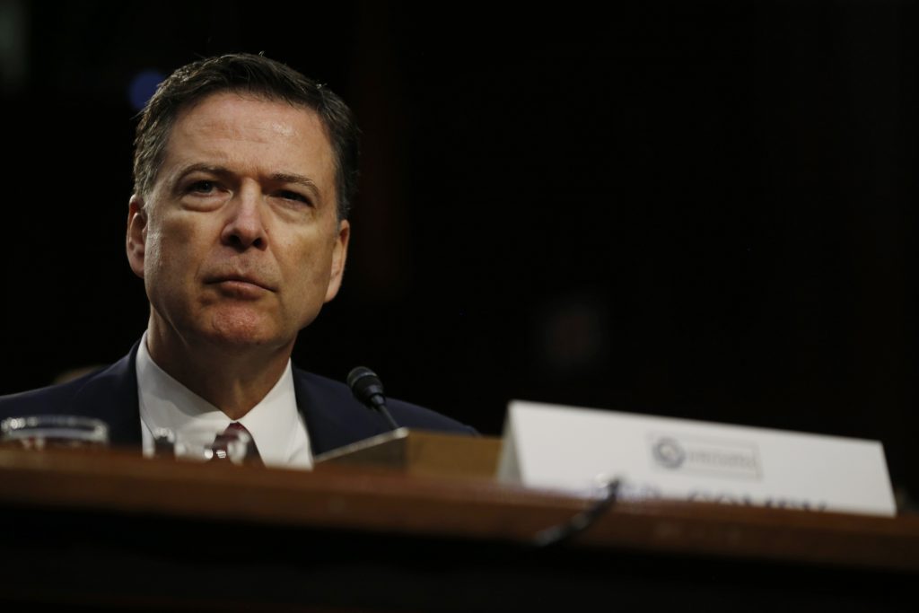 Former FBI Director Comey testifies before a Senate Intelligence Committee hearing in Washington