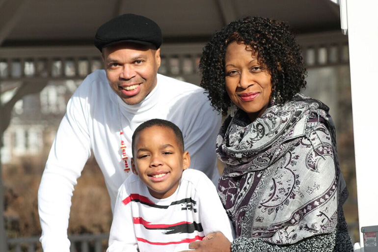 Paulette Thompson-Clinton, a minister with breast cancer that has spread to her bones, stands with her husband and son. Thompson-Clinton said she fired an oncologist for being too negative. (Courtesy of Ameer Brooks/DJAmeerPhotography)