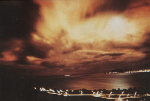 The flash created by Starfish Prime explosion as seen through heavy cloud cover from Honolulu 1,445 km away. Photo via Wikimedia