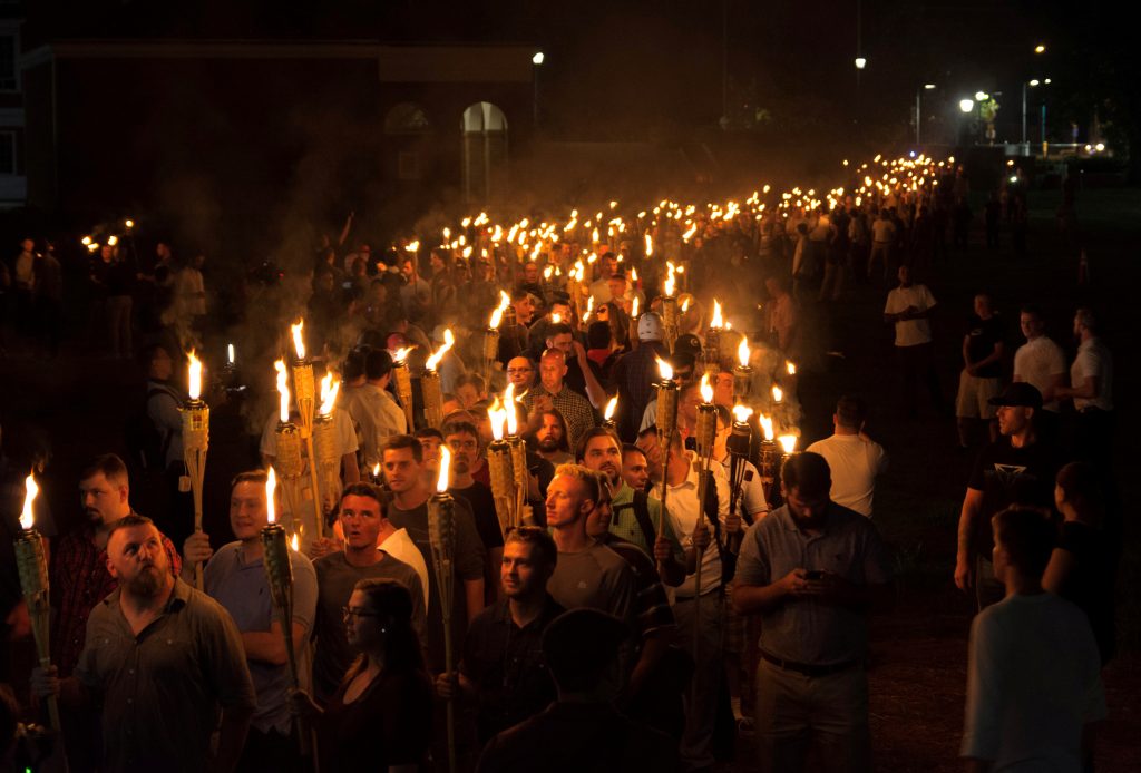 White nationalists carry torches on the grounds of the University of Virginia, on the eve of a planned Unite The Right rally in Charlottesville, Virginia, U.S. August 11, 2017. Picture taken August 11, 2017. Photo by Alejandro Alvarez/News2Share via REUTERS