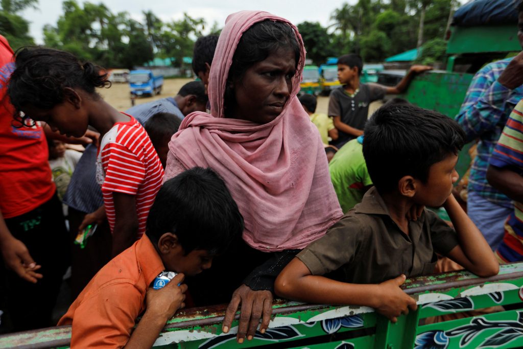 Rohingya refugees ride on the back of the truck to a camp near Teknaf , Bangladesh, on Oct. 12. Photo by Jorge Silva/Reuters