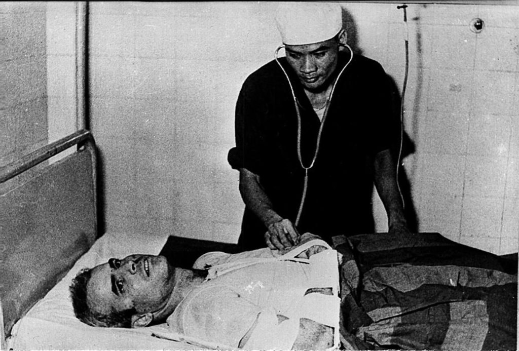 HANOI, VIET NAM: A photo taken in 1967 shows US Navy Airforce Major John McCain being examined by a Vietnamese doctor. John McCain, current US presidential hopeful, was captured in 1967 at a lake in Hanoi after his Navy warplane was been downed by Northern Vietnamese army during the Vietnam War. One of his rescuers said 24 February 2000, McCain was well treated after being pulled from the lake by villagers. McCain said that upon capture he was beaten by an angry mob and bayoneted in the groin. (B/W ONLY) AFP PHOTO (Photo credit should read AFP/Getty Images)