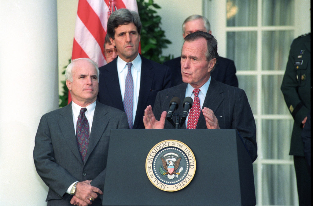 President George Bush addresses reporters at the White House, October 23, 1992, on the release of documents by Hanoi on Americans missing in Southeast Asia. Bush, with Senator John McCain (L) and Senator John Kerry, said the information will allow the United States to "begin writing the last chapter of the Vietnam War." REUTERS/Mike Theiler US ELECTIONS AS - RP1DRICQWWAB