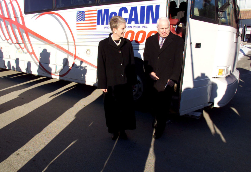 Shadows from waiting media fall upon Republican presidential hopeful John McCain and his wife Cindy as they arrive for the Raymond town meeting January 29. McCain is making his way around the state in frantic bid to win the Febraury 1 primary. KL/JP - RP2DRHYURPAB
