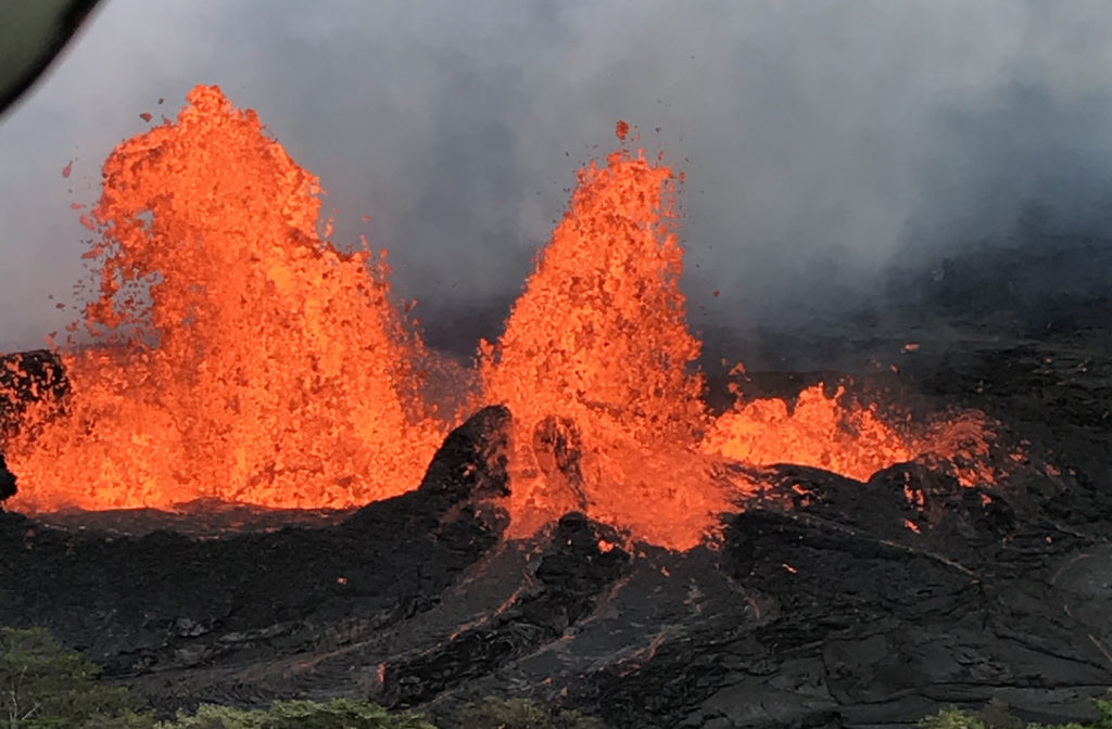 Helicopter overflight of Kīlauea Volcano's Lower East Rift Zone shows fountaining at Fissure 22. Photo by U.S. Geological Survey
