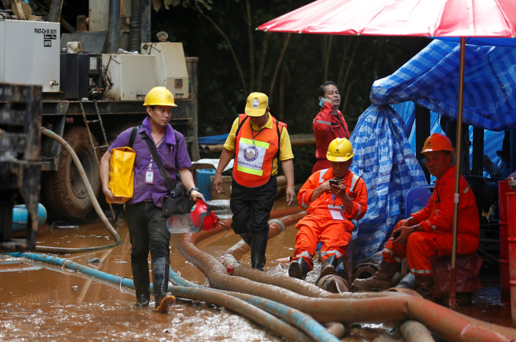 Tubes are used to try to pump water from the network of caves leading to where the boys are trapped. Photo by Soe Zeya Tun/Reuters