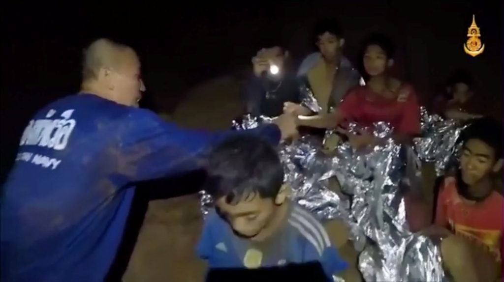 A medic treats the boys in Chiang Rai, Thailand, in this still image taken from a July 3 video by a Thai Navy Seal. Thai Navy Seal/Handout via Reuters TV