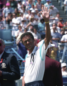 Tennis great Arthur Ashe waves to the crowd at the National Tennis Center in New York in this August 30, 1992. Photo by Ray Stubblebine/Reuters