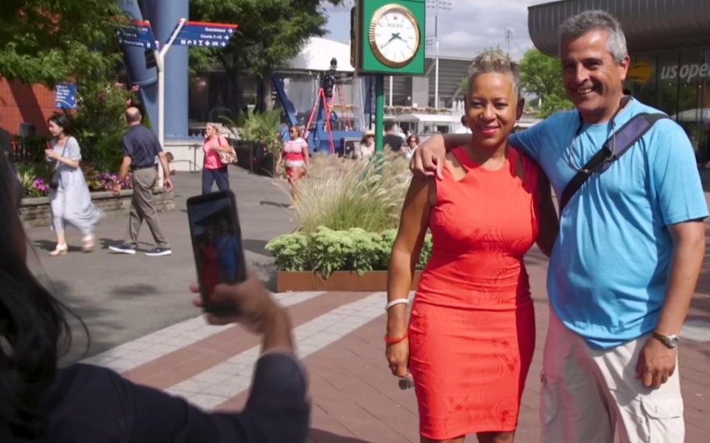 USTA President Katrina Adams poses for a picture with a fan. Photo by PBS NewsHour Weekend