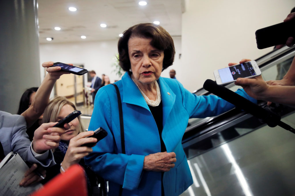 U.S. Senator Dianne Feinstein (D-CA), talks to reporters about the Supreme Court nomination of Judge Brett Kavanaugh in the wake of a woman's accusation that Kavanaugh sexually assaulted her 36 years ago, on Capitol Hill in Washington, U.S., September 18, 2018. REUTERS/Mike Segar - RC15B7D0DF10