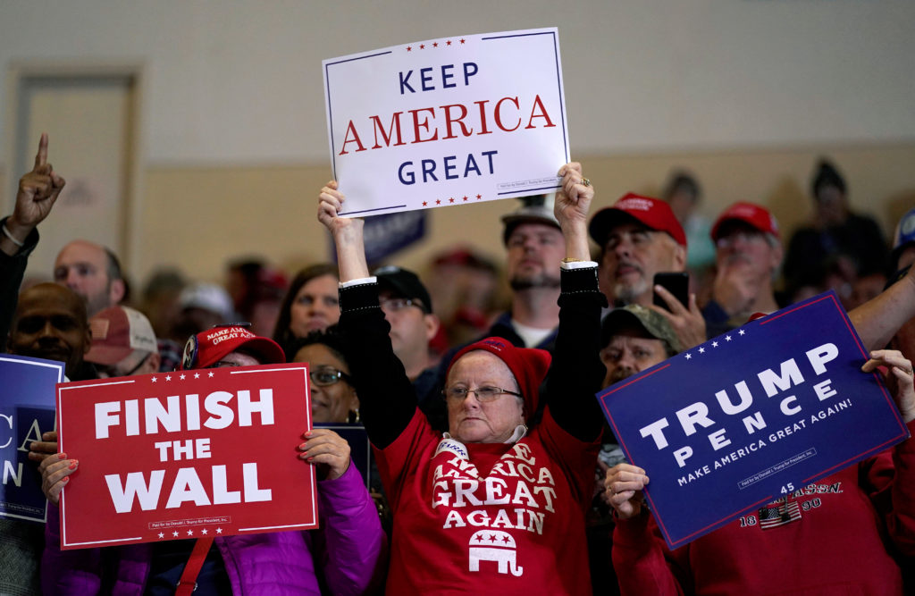 Supporters wave signs before U.S. President Donald Trump arrives to speak at a Make America Great Again rally in Richmond, Kentucky, U.S., October 13, 2018. Photo by REUTERS/Joshua Roberts
