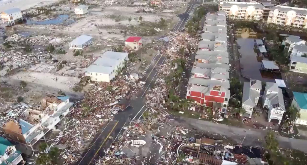 An aerial view shows debris strewn over streets after Hurricane Michael blew through Mexico Beach, Florida, in this still image taken from drone video obtained from social media. Photo by Duke Energy via Reuters