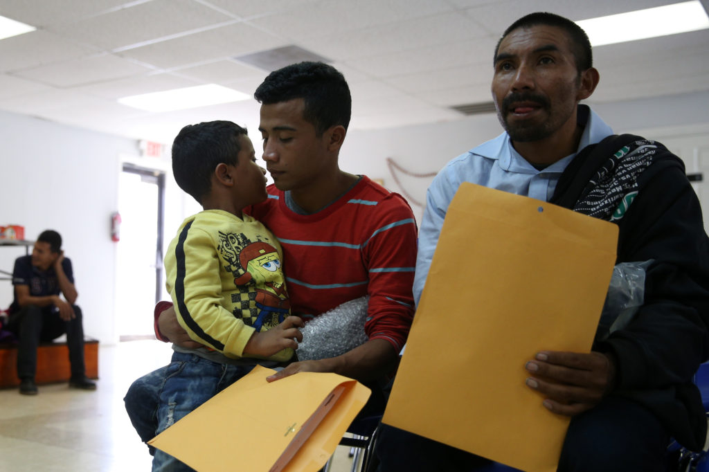 After being detained and released by law enforcement, undocumented immigrants from Central America wait for assistance with bus transportation to travel elsewhere in the U.S. at the Catholic Charities relief center in McAllen, Texas. The affects of unauthorized immigrations on the U.S. economy are difficult to measure, but researchers believe they use fewer government resources because they are not eligible for most public benefits. Photo by Loren Elliott/Reuters.