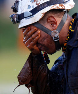 A member of rescue team reacts, upon returning from the mission, after a tailings dam owned by Brazilian mining company Vale SA collapsed, in Brumadinho, Brazil January 27, 2019. Photo by Adriano Machado/Reuters