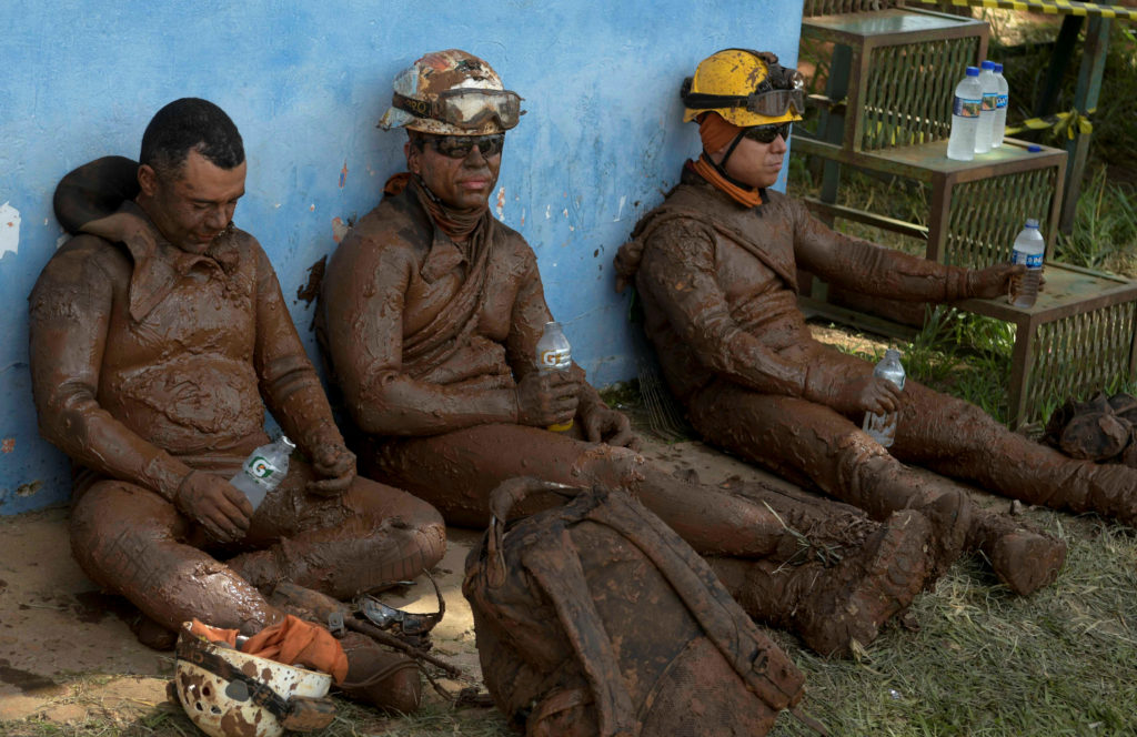 Members of a rescue team react upon returning from the mission, after a tailings dam owned by Brazilian mining company Vale SA collapsed, in Brumadinho, Brazil January 28, 2019. Photo by Washington Alves/Reuters