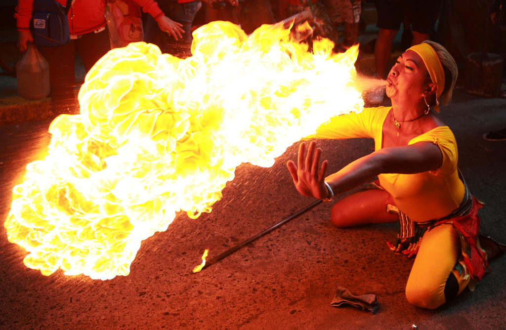 A performer blows fire during Chinese New Year celebrations in Manila, Philippines. Photo by Eloisa Lopez/Reuters