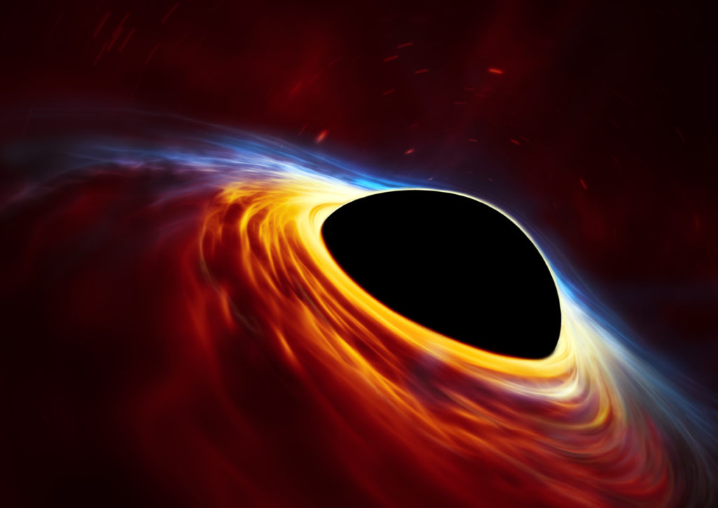 This is not an actual image of a black hole. This artist’s impression depicts a rapidly spinning supermassive black hole surrounded by an accretion disc. This thin disc of rotating material consists of the leftovers of a Sun-like star which was ripped apart by the tidal forces of the black hole. Shocks in the colliding debris as well as heat generated in accretion led to a burst of light, resembling a supernova explosion. Illustration and caption by European Southern Observatory, European Space Agency, M. Kornmesser