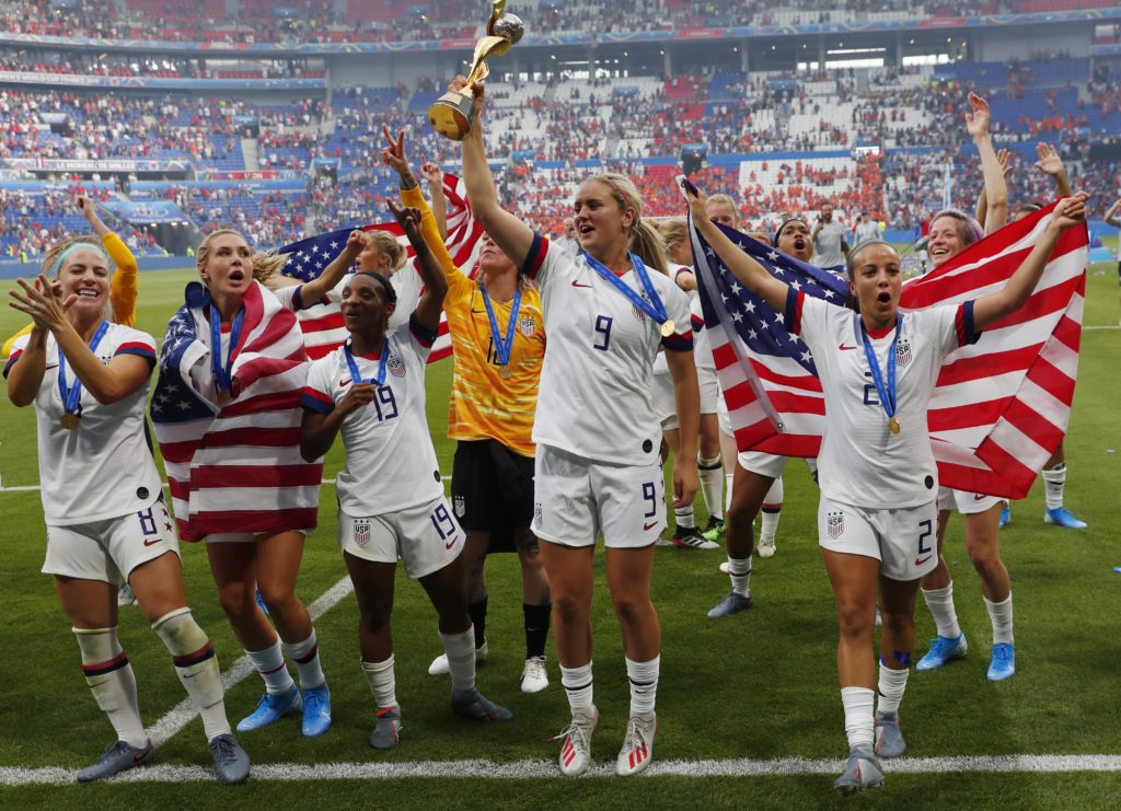 United States midfielder Lindsey Horan (9) hoists the World Cup trophy and celebrates with teammates after defeating the Netherlands in the championship match of the FIFA Women's World Cup France 2019 at Stade de Lyon. The final match brought in more than 14 million viewers. Photo by Michael Chow-USA TODAY Sports