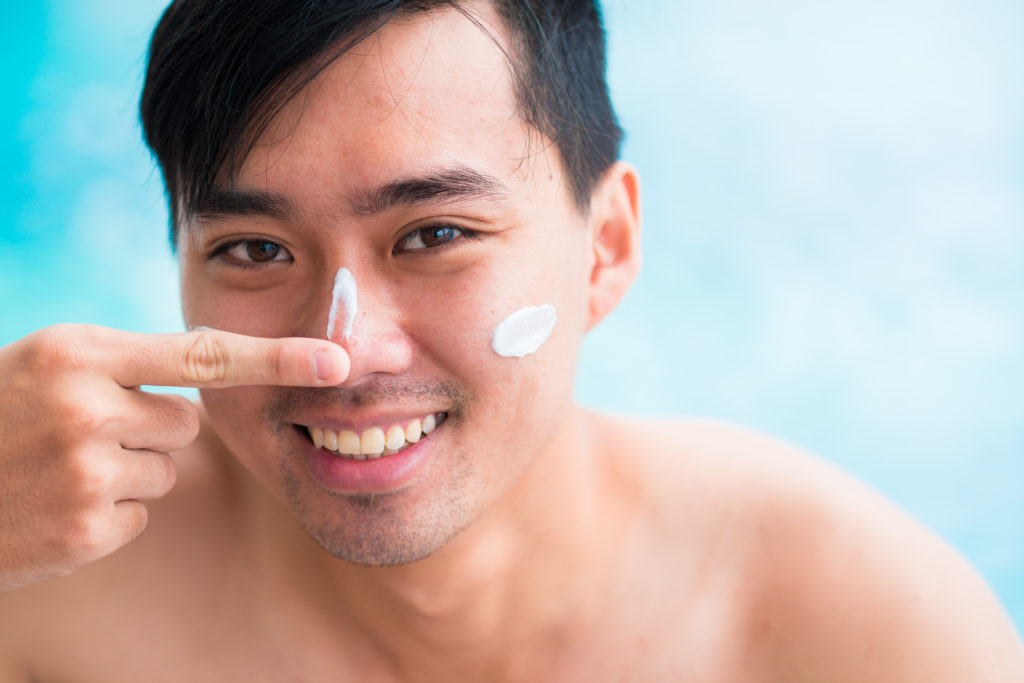 Sunscreen is part of a whole sun protection plan, including sunglasses, hats and other protective clothing. Photo by DragonImages/via Adobe Stock