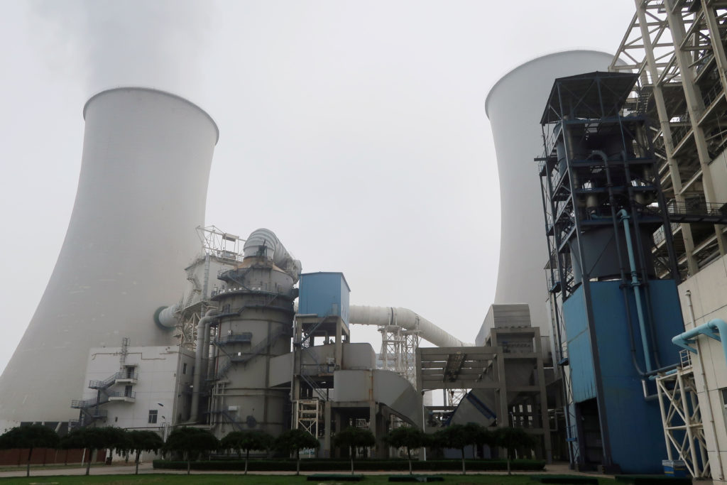 Smoke is seen from a cooling tower of a China Energy ultra-low emission coal-fired power plant in Sanhe, Hebei province, China July 18, 2019. Photo by REUTERS/Shivani Singh