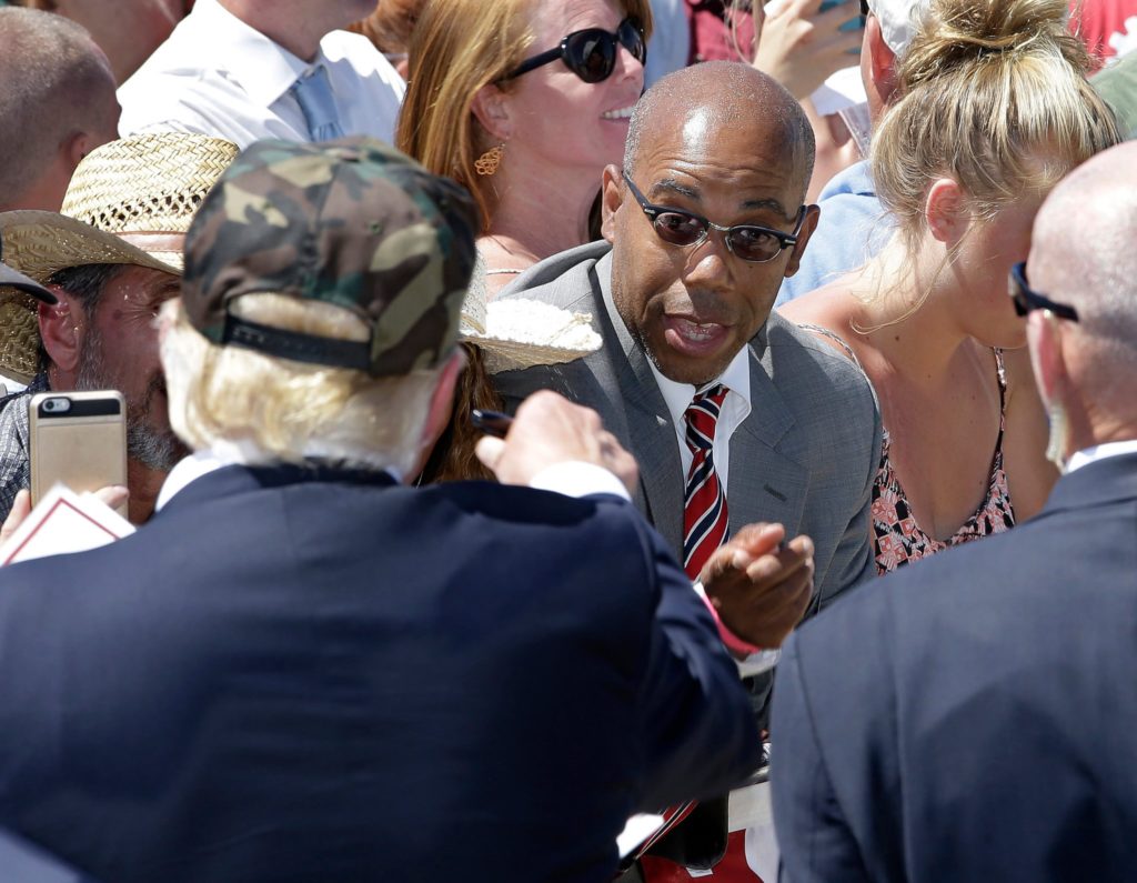 In this photo taken June 3, 2016, Republican presidential candidate Donald Trump, left, talks to Gregory Cheadle after a r...