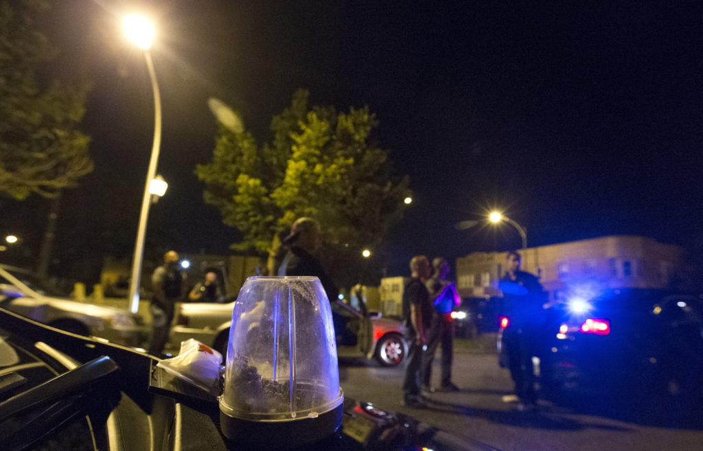 A container of marijuana found during a search of a car by Cook County Sheriff police officers is seen as officers take a man into custody in the Austin neighborhood in Chicago, Illinois, United States, September 10, 2015. Photo by REUTERS/Jim Young