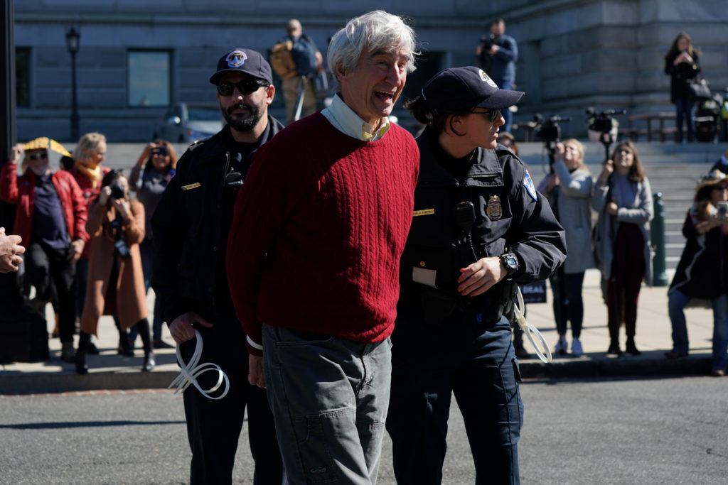 Actor Sam Waterston is handcuffed and detained by Capitol Police during the "Fire Drill Fridays" protest outside the Library of Congress in Washington, U.S., October 18, 2019. Waterson's co-star in "Grace & Frankie", Jane Fonda, lead the demonstration and was also detained. Photo by Sarah Silbiger/Reuters