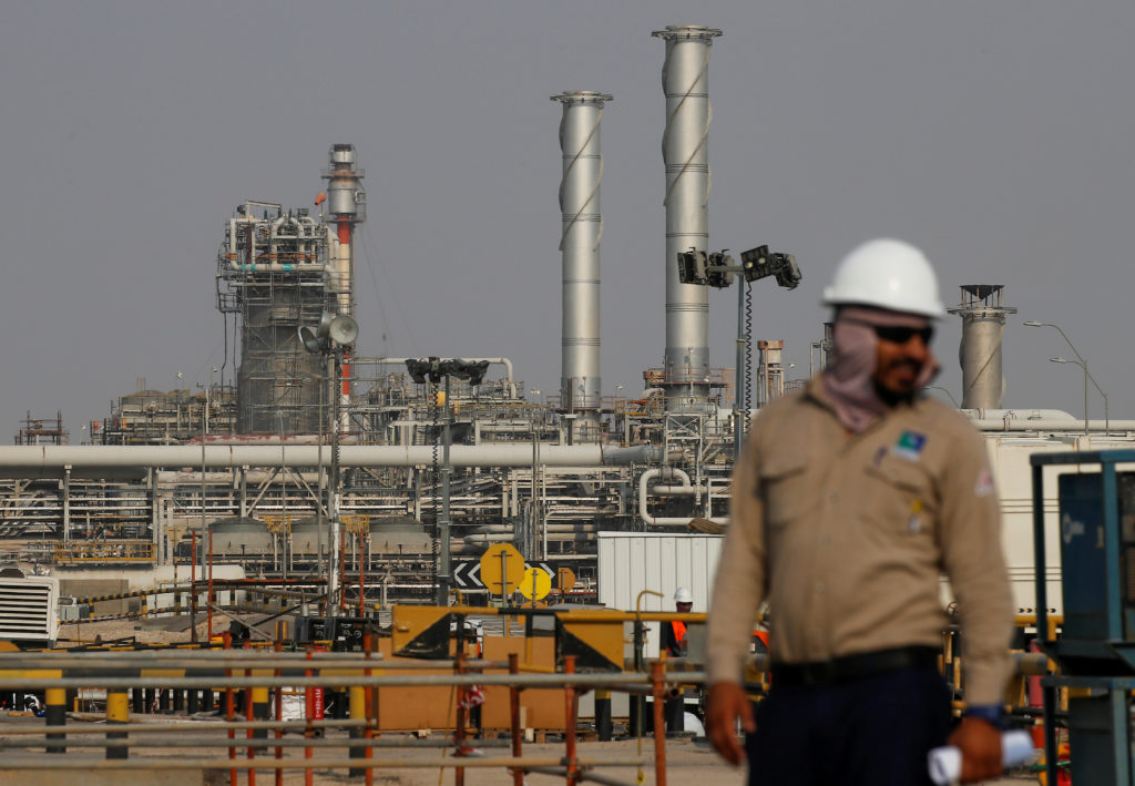 FILE PHOTO: An employee looks on at Saudi Aramco oil facility in Abqaiq, Saudi Arabia October 12, 2019. REUTERS/Maxim Shemetov/File Photo/File Photo