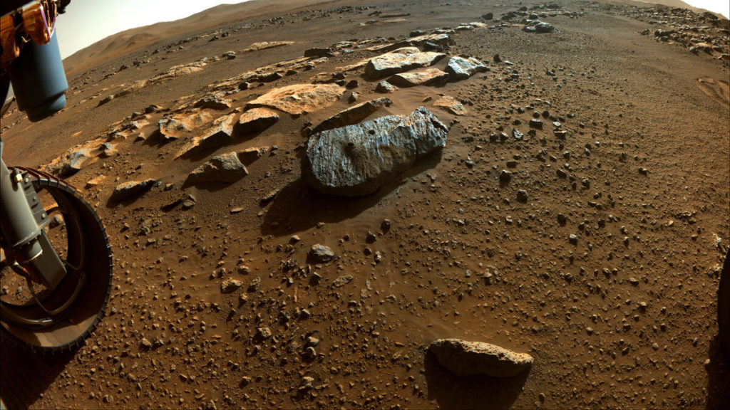 This image taken by NASA's Perseverance rover shows two holes where the rover's drill obtained chalk-size samples from rock nicknamed "Rochette."