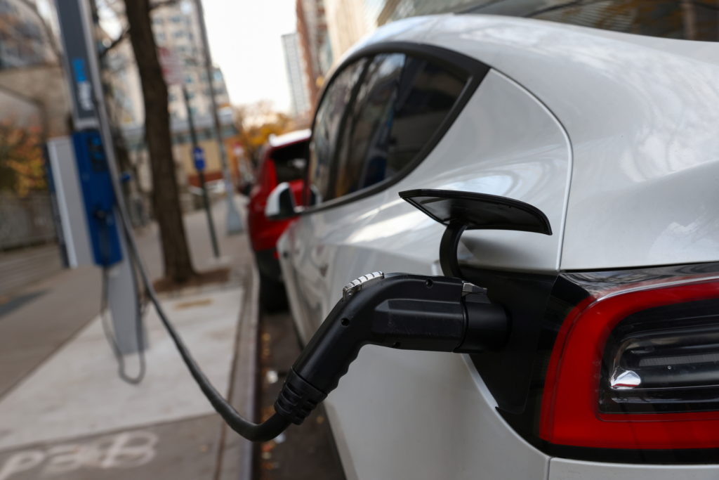 An electric vehicle is seen charging in Manhattan, New York