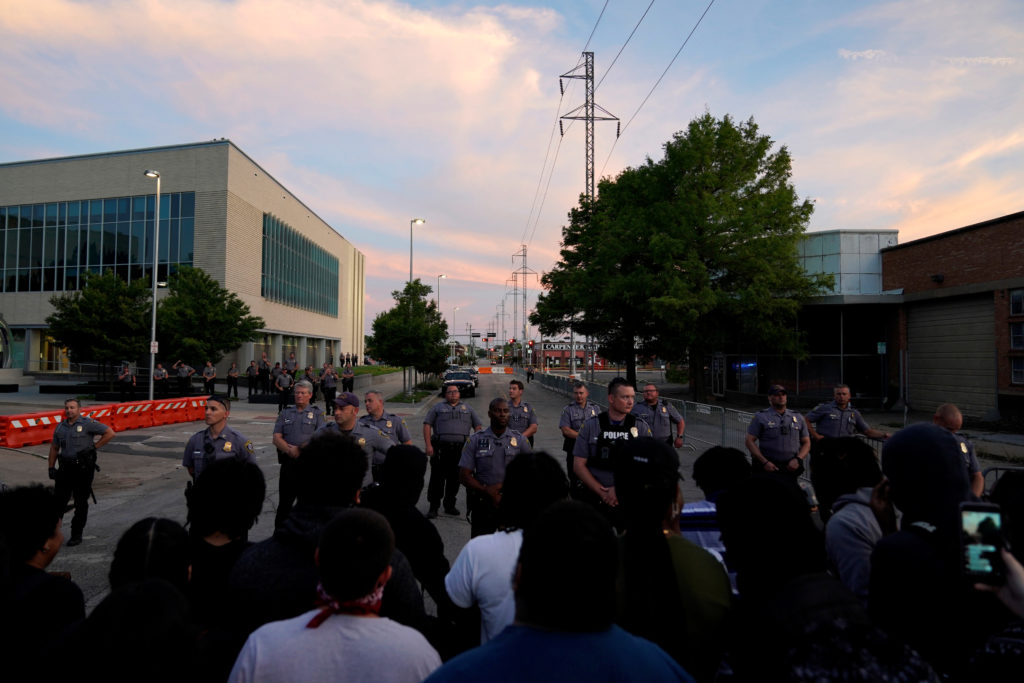 In this May 2020 photo, Oklahoma City Police officers speak with a crowd of protesters during nationwide demonstrations following the police killing of George Floyd in Minneapolis. Photo by Nick Oxford/Reuters