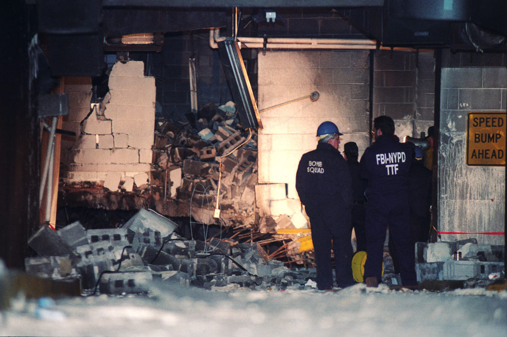 Investigators view the rubble in a parking garage below the World Trade Center in New York