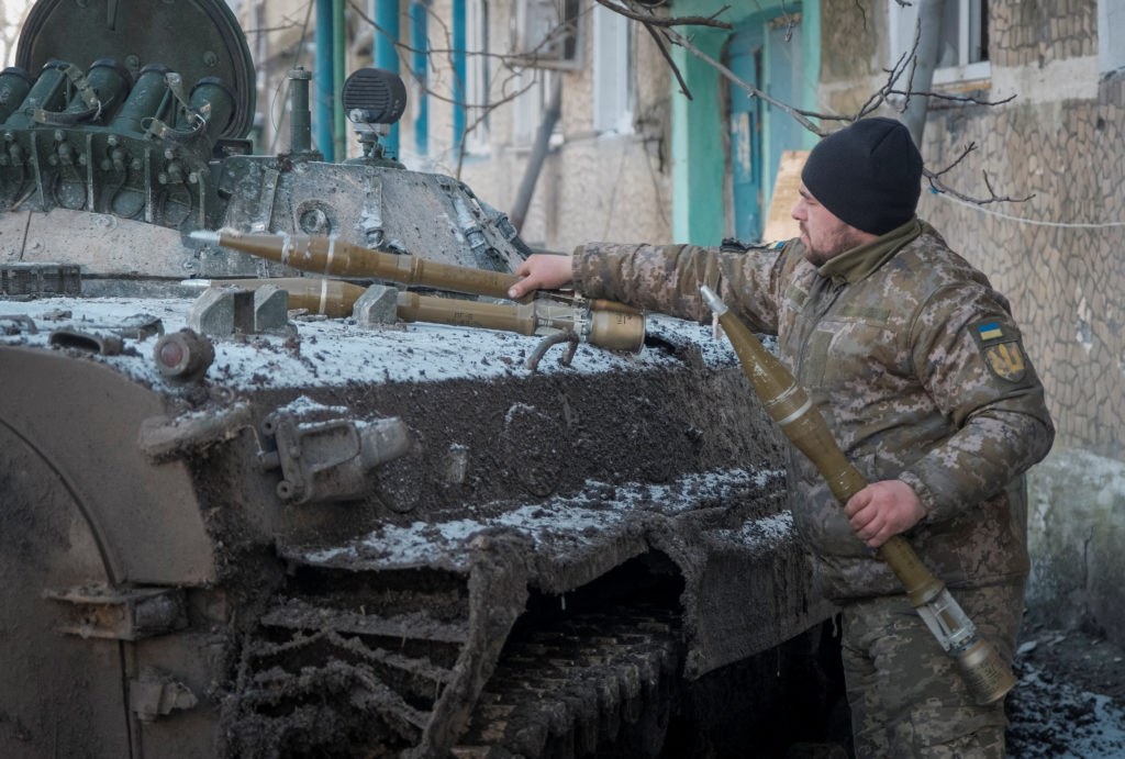 Ukrainian service member loads anti tank grenade at a BMP-1 infantry fighting vehicle in the front line city of Vuhledar