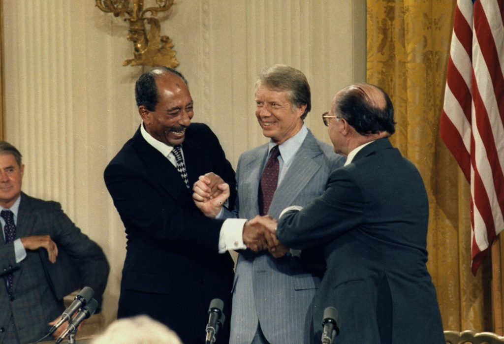 Anwar Sadat, Jimmy Carter and Menachem Begin at the Camp David Accords Signing Ceremony. ca. 09/17/1978