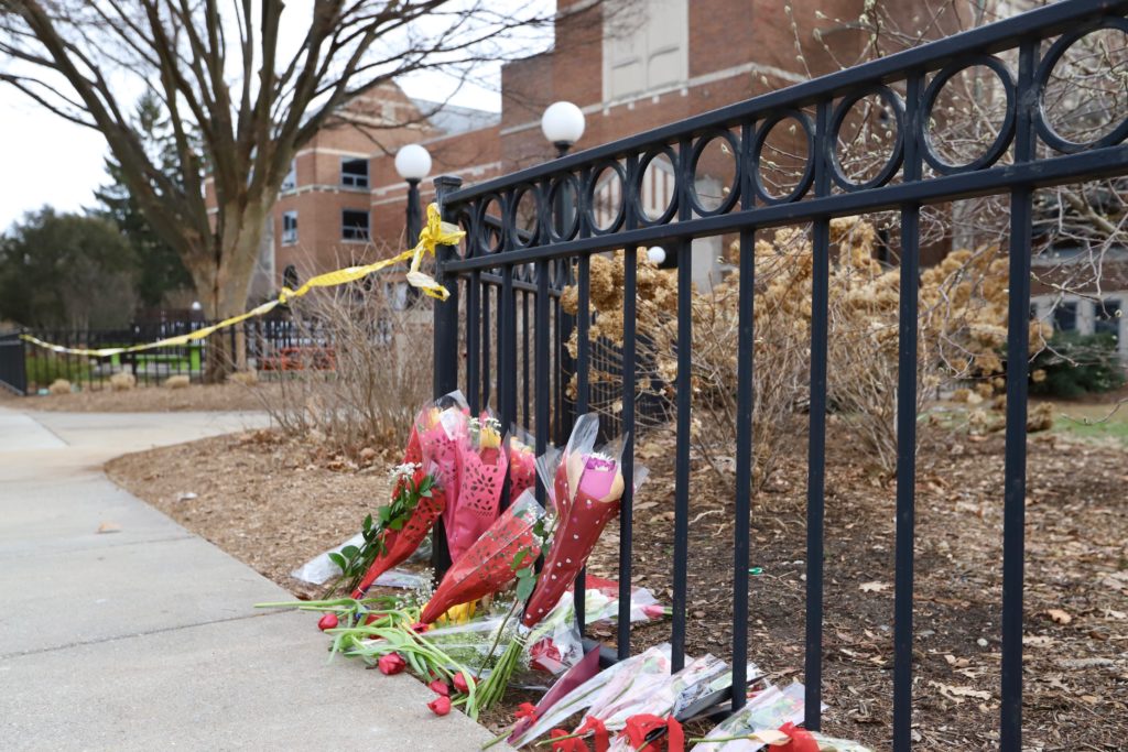 Flowers left outside the Michigan State University (MSU) Union in East Lansing, Michigan, after a mass shooting on campus killed three students and injured five students, on Feb. 14, 2023. Photo by Campbell Berg.