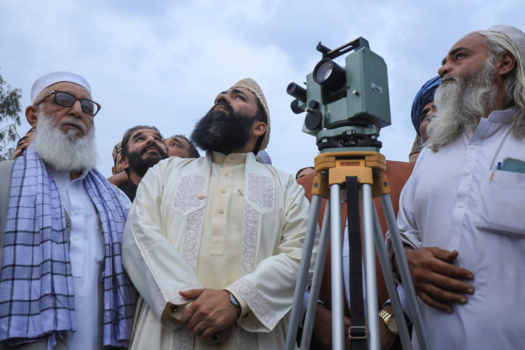 Members of Pakistan's moon sighting committee gather to look for the new moon that will mark the start of Ramadan, in Char...