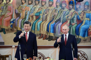 Russian President Vladimir Putin and Chinese President Xi Jinping attend the reception in Moscow