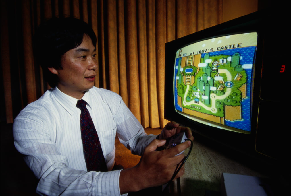 Shigeru Miyamoto, creator of Mario and other characters and video games for Nintendo, plays Super Mario World on a Nintendo Super NES. Photo by Ralf-Finn Hestoft/Corbis via Getty Images