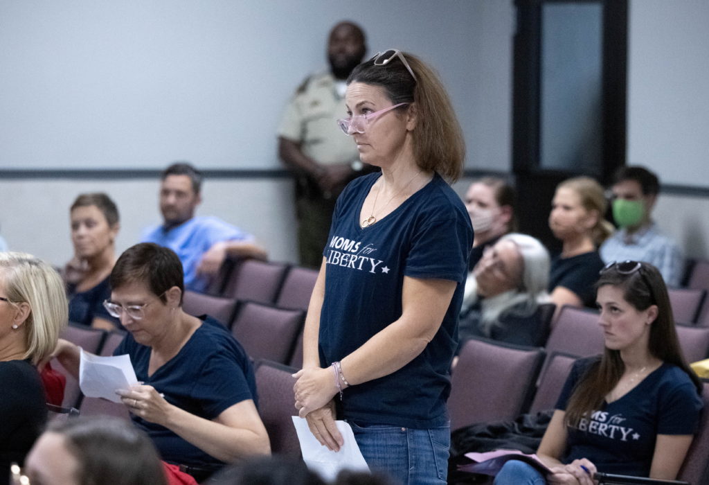 Members of Moms for Liberty speak at a school board hearing in Franklin