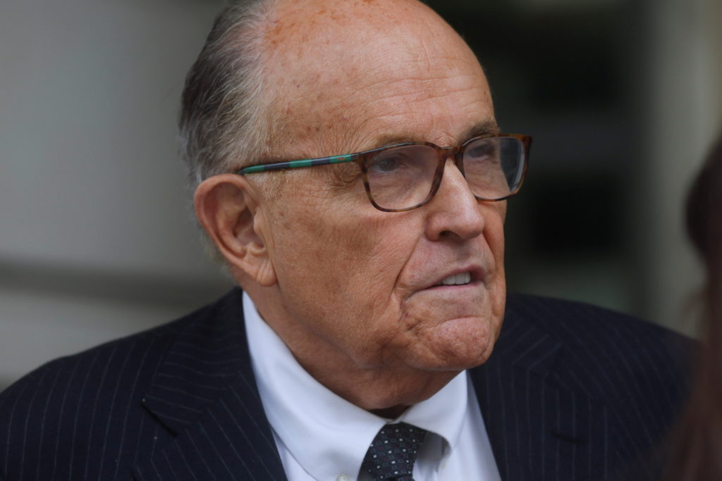 Rudy Giuliani exits U.S. District Court after a hearing in a defamation suit against him in Washington