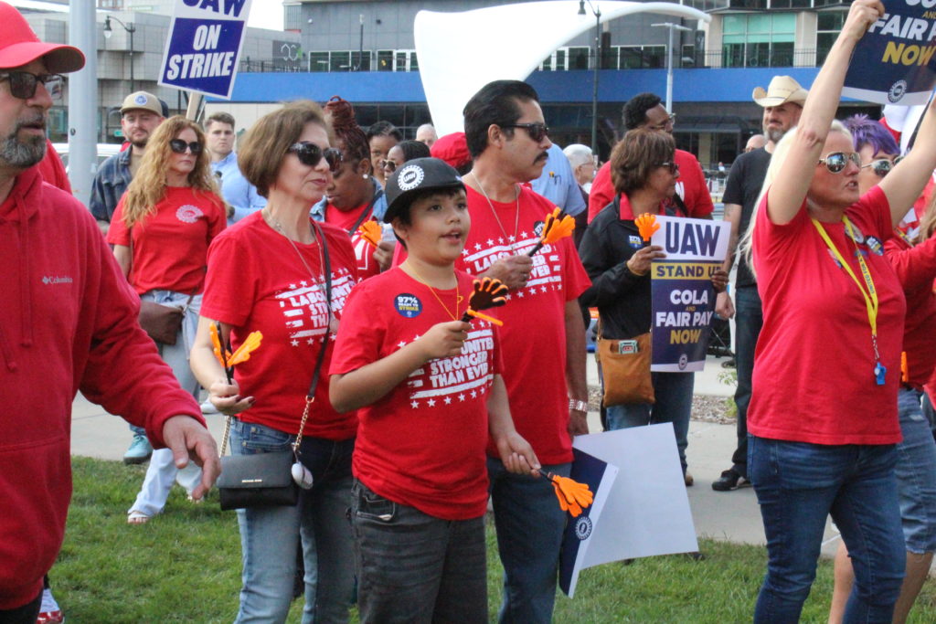 UAW members attended the UAW’s “Stand up for our Communities against Corporate Greed” rally in Detroit together with family and friends. September 15, 2023. Photo by Frances Kai-Hwa Wang for the PBS NewsHour