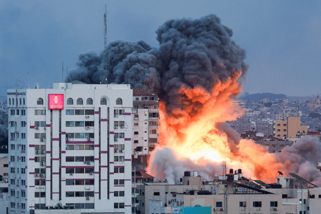 Smoke and flames billow after Israeli forces struck a high-rise tower in Gaza City