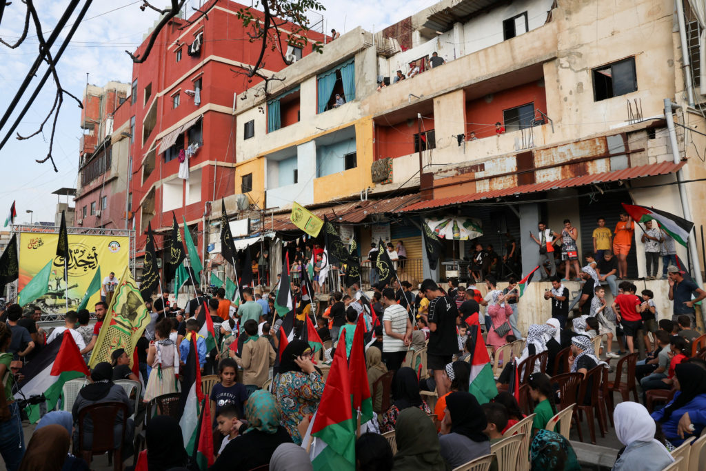 Palestinian refugees attend a rally to express solidarity with Palestinians, in Beirut