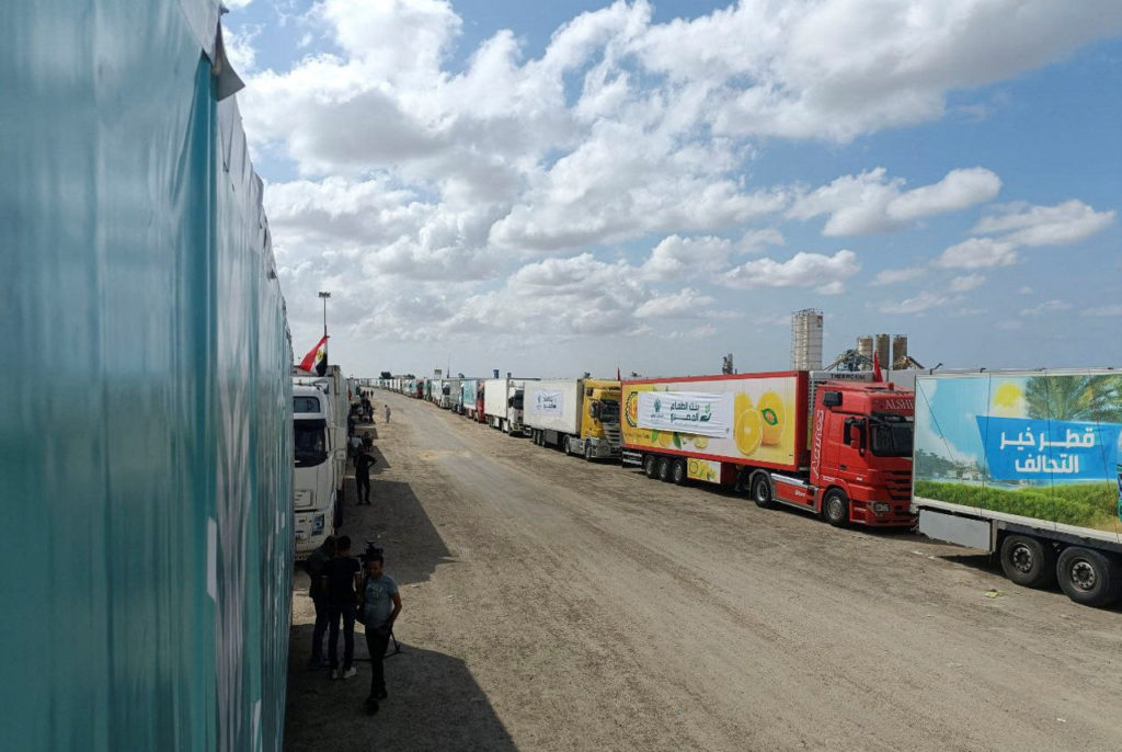 Trucks carrying humanitarian aid from Egyptian NGOs for Palestinians, wait for the reopening of the Rafah crossing at the ...