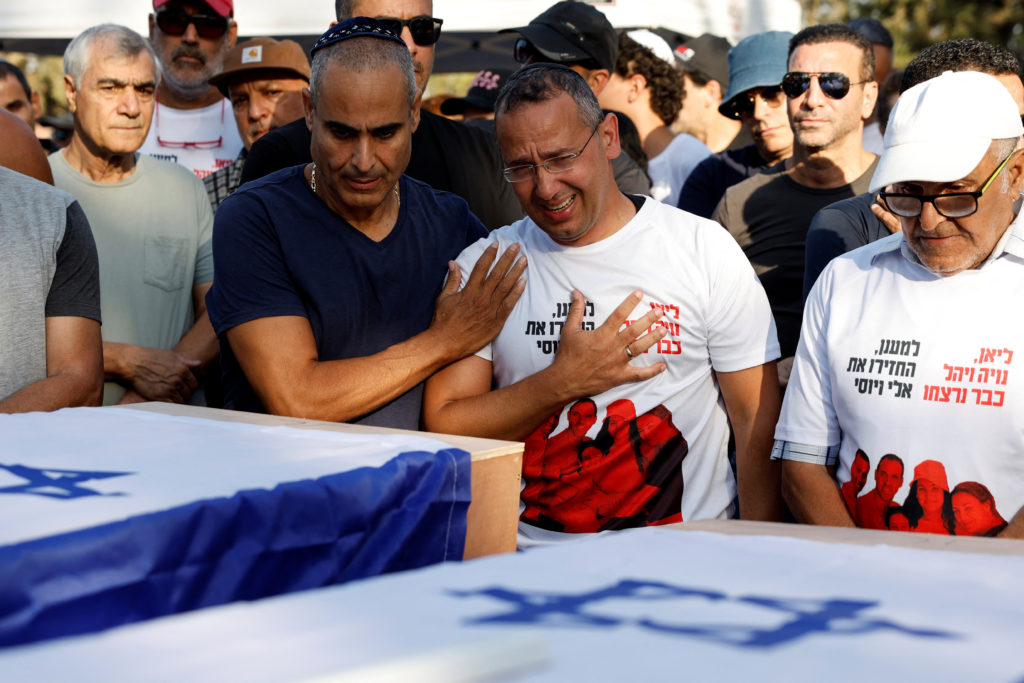 Friends and family mourn British-Israelis Lianne Sharabi and her daughters at their funeral in Kfar Harif