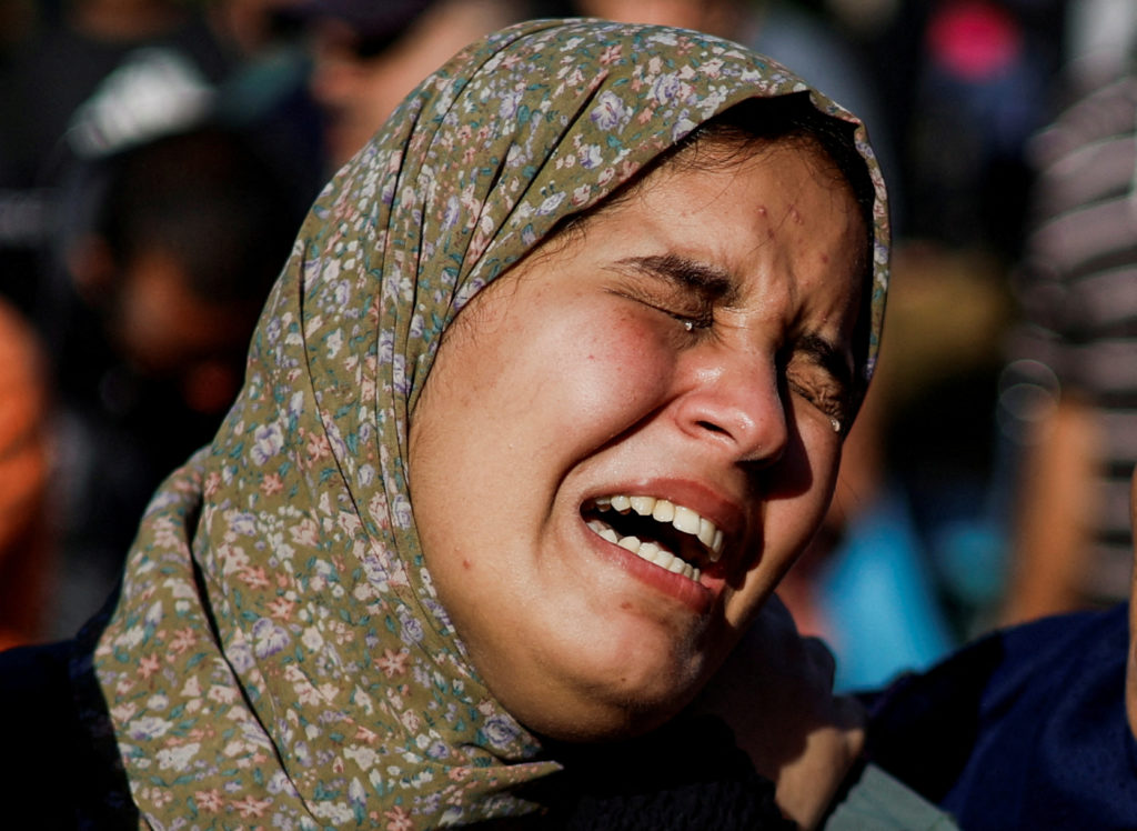 A woman mourns during a funeral for Palestinians killed by Israeli strikes, in Khan Younis