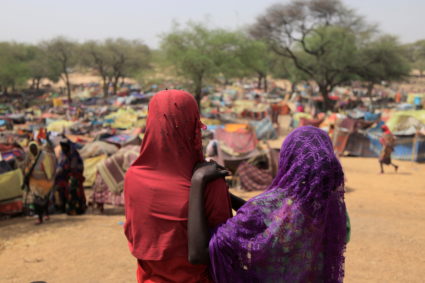 FILE PHOTO: Sudanese girls who fled the conflict in Sudan's Darfur region, and were previously internally displaced in Sudan, look at makeshift shelters near the border between Sudan and Chad, while taking refuge in Borota, Chad May 13, 2023. Photo by Zohra Bensemra/Reuters