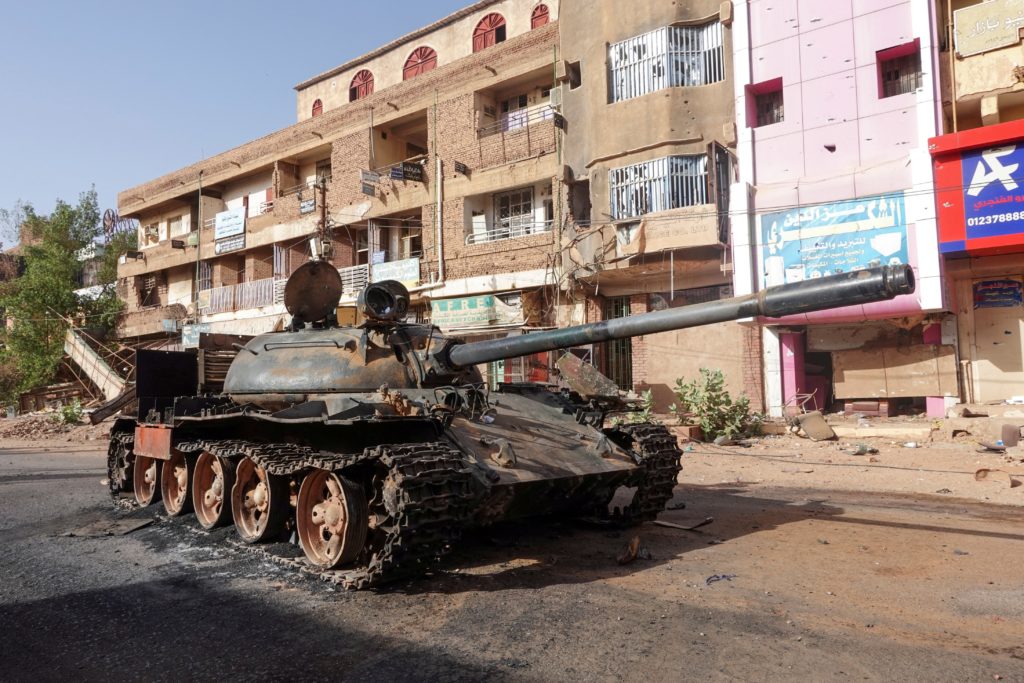 FILE PHOTO: A damaged army tank is seen on the street, in Omdurman